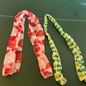 One red flower scarf and one green heart scarf